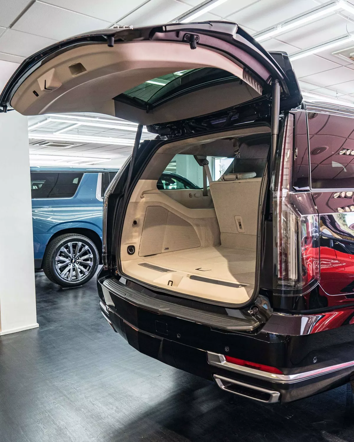 Escalade with its tailgate open in the showroom
