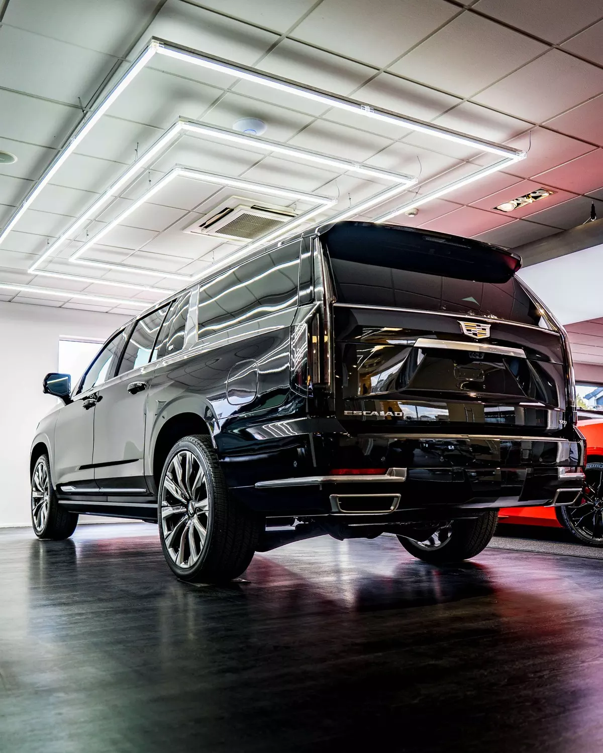 Rear three-quarter view of the black Cadillac Escalade