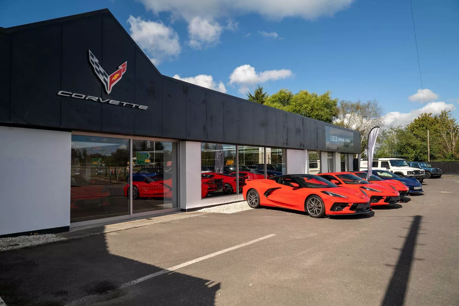 Corvette Birmingham dealership with red Corvette sports cars outside