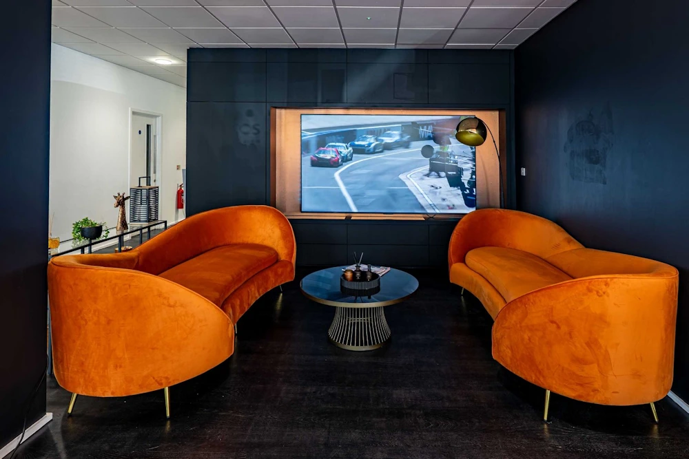 Orange lounge chairs and sofa inside Grange Birmingham