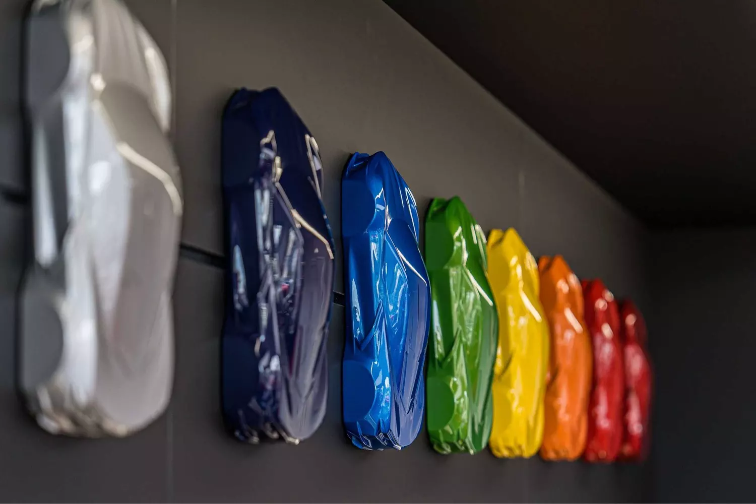 Corvette paint colour samples displayed on the showroom wall