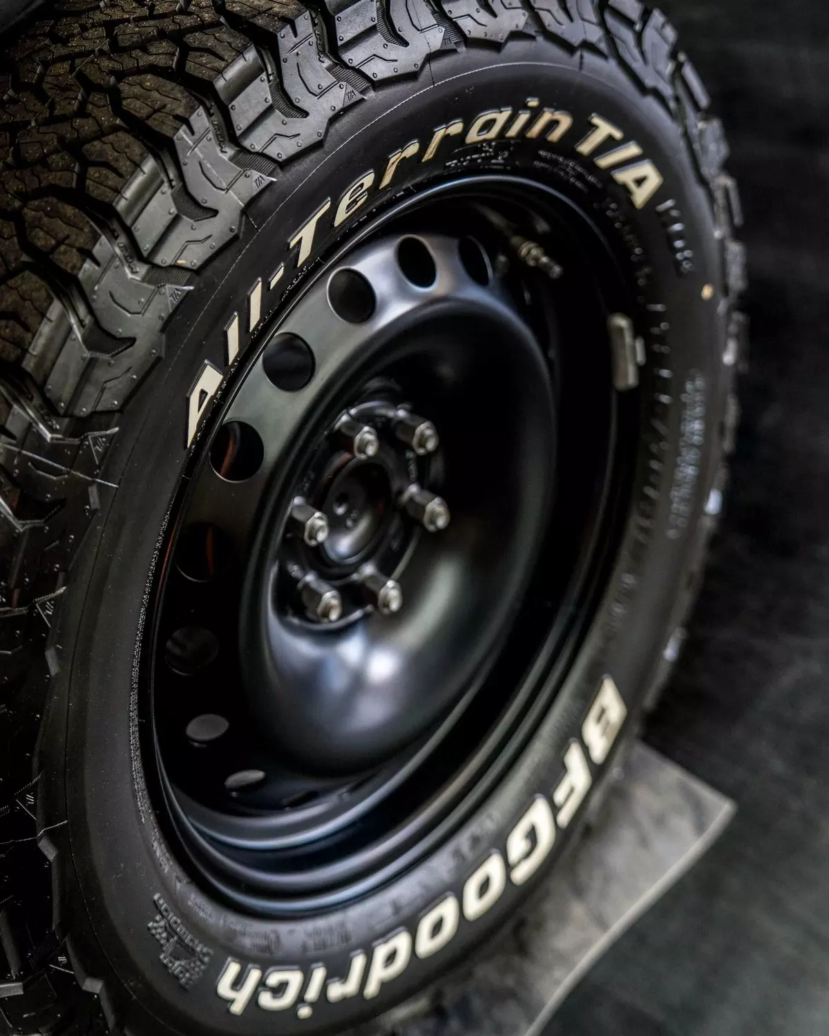 BFGoodrich All-Terrain tyre and wheel on a showroom Grenadier