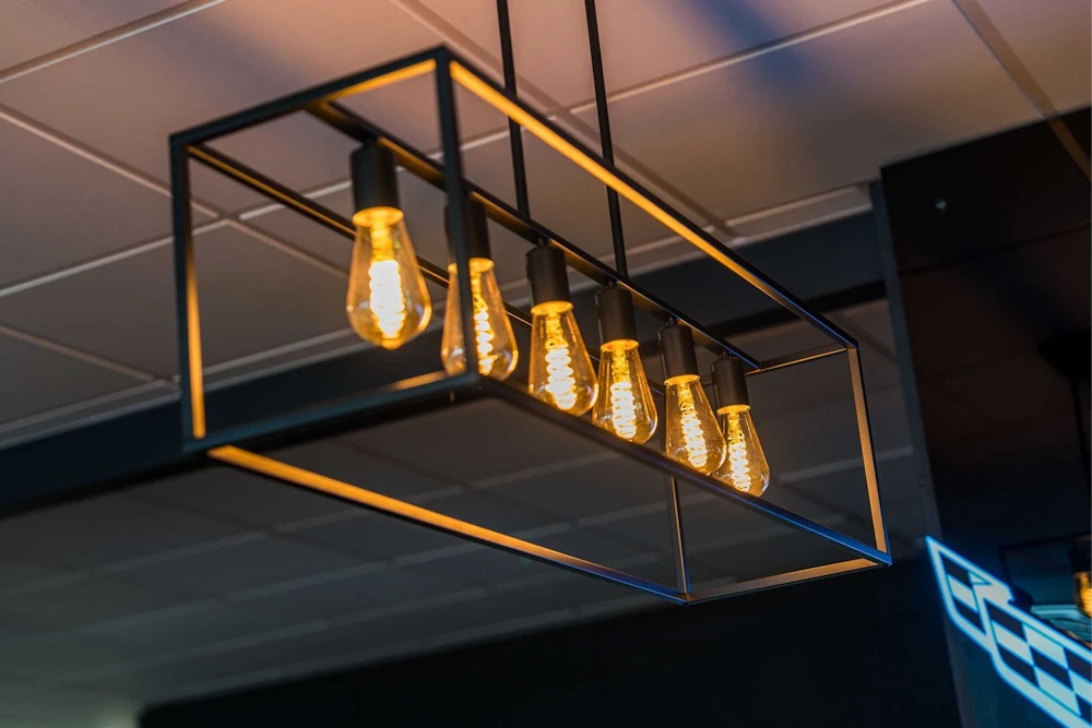 Warm pendant lighting above the Grange Birmingham bar