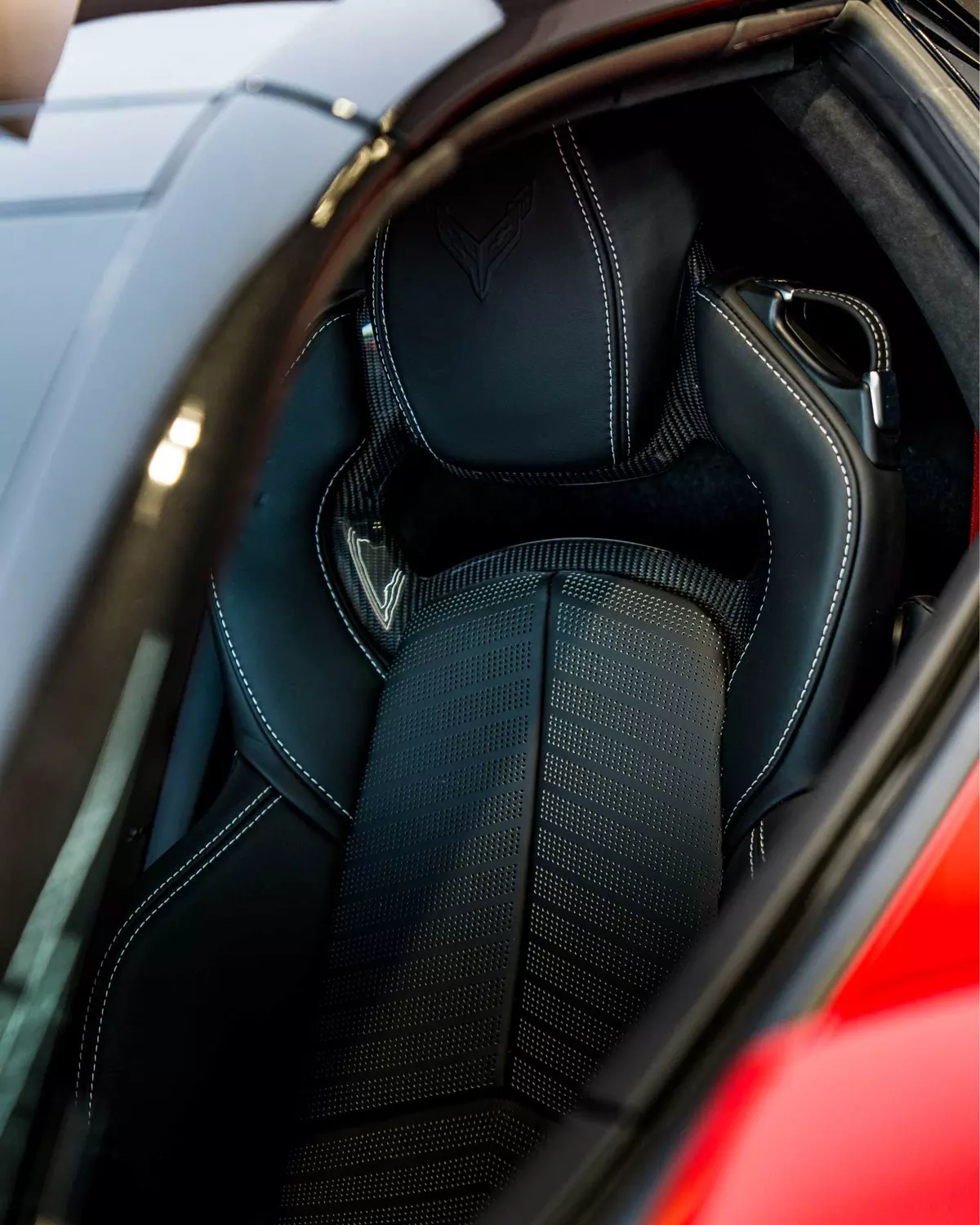 Black Corvette sports seat and head restraint