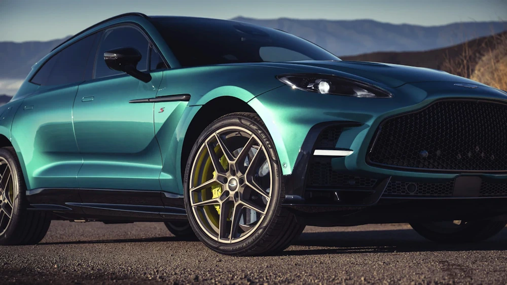 Green Aston Martin DBX S in official exterior photography
