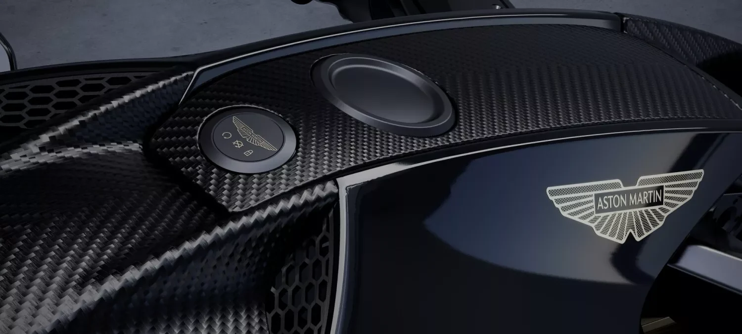 Aston Martin wings badge on the AMB 002 carbon-fibre bodywork beside the instruments