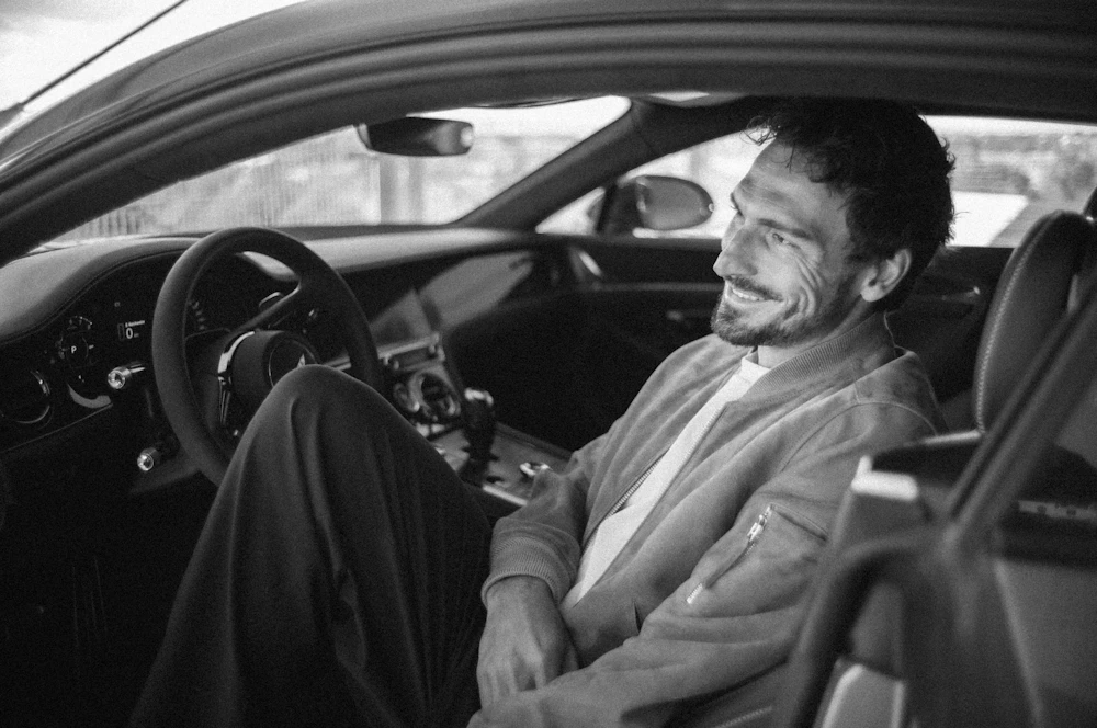 Mats Hummels seated inside a Bentley Continental GT
