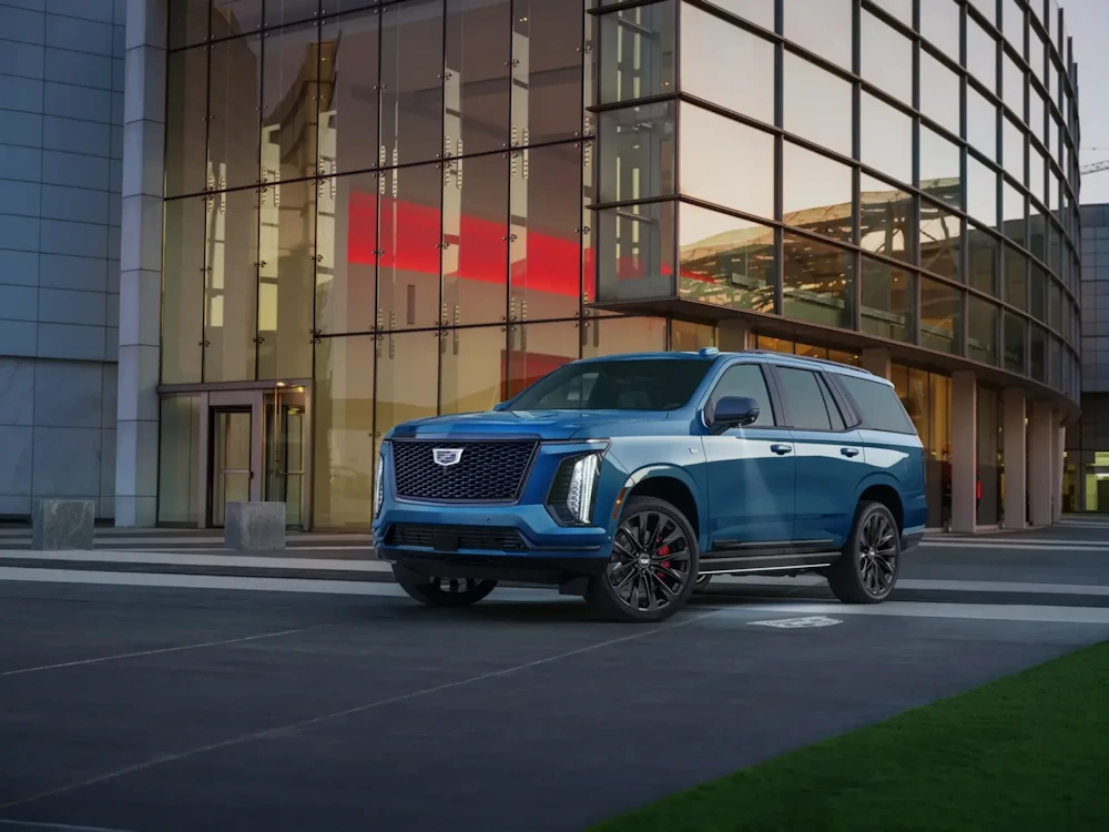 Cadillac Escalade outside a glass-fronted building