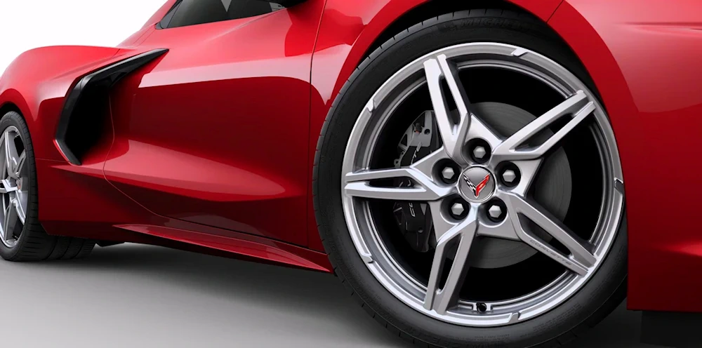 Close-up of a red Corvette Stingray wheel and front wing
