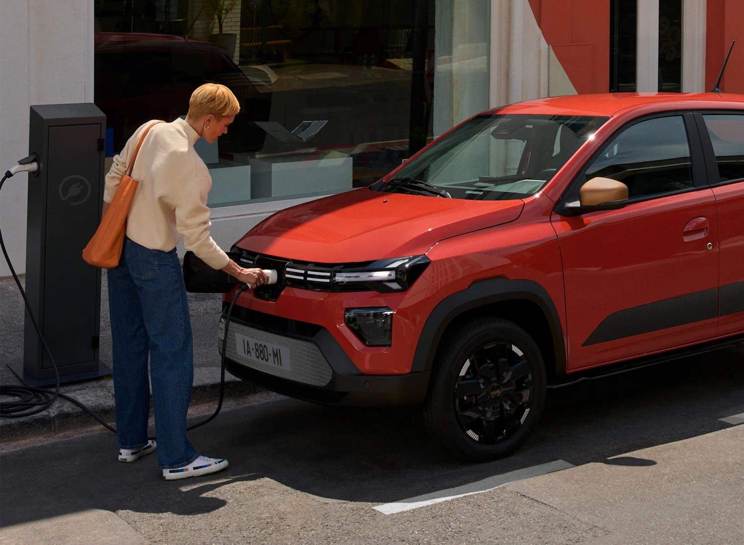 Dacia Spring connected to an electric-car charger