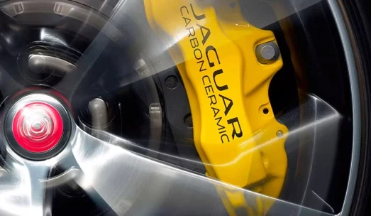 Jaguar-branded carbon-ceramic brake caliper and wheel detail