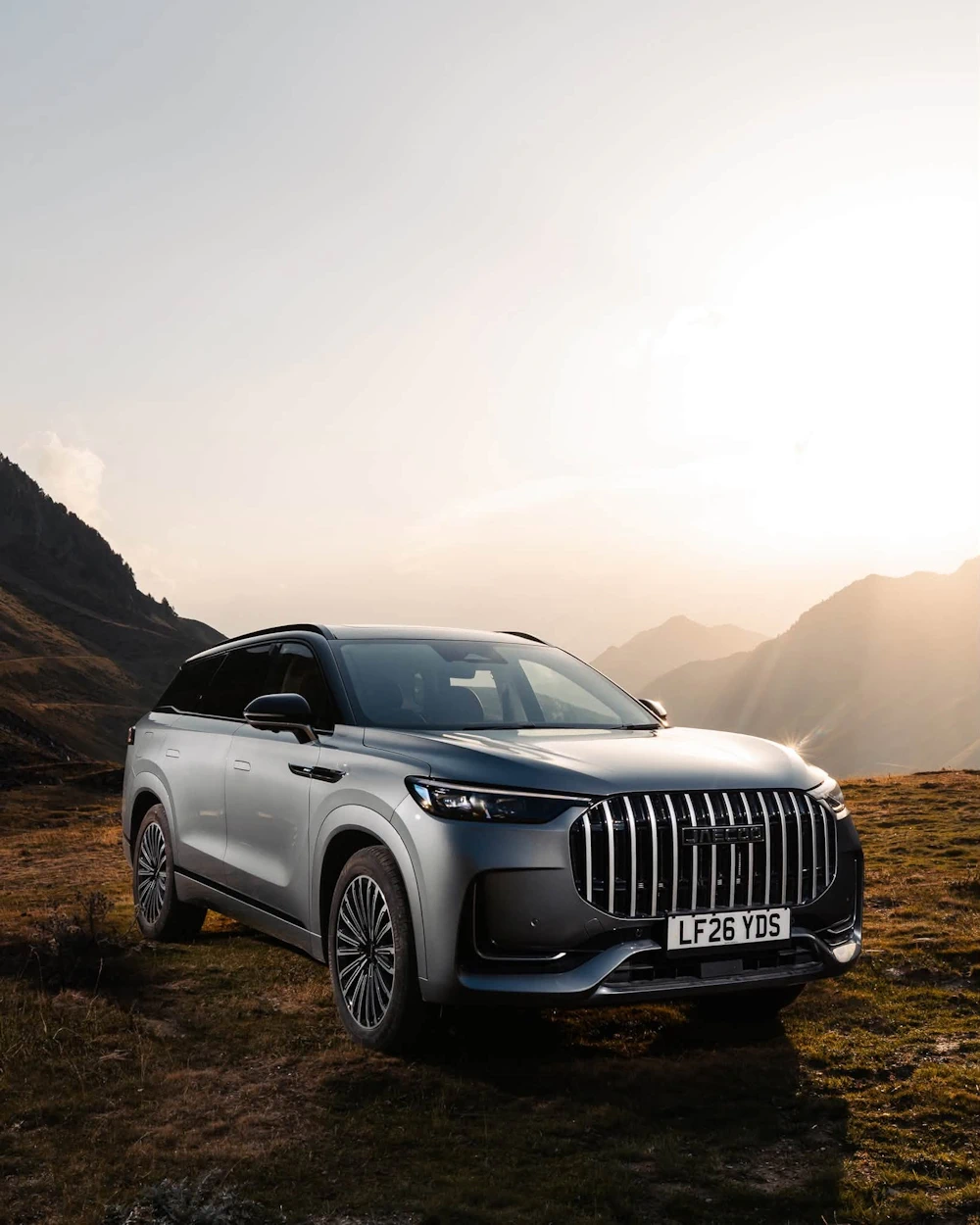 Silver JAECOO 8 in a mountain landscape