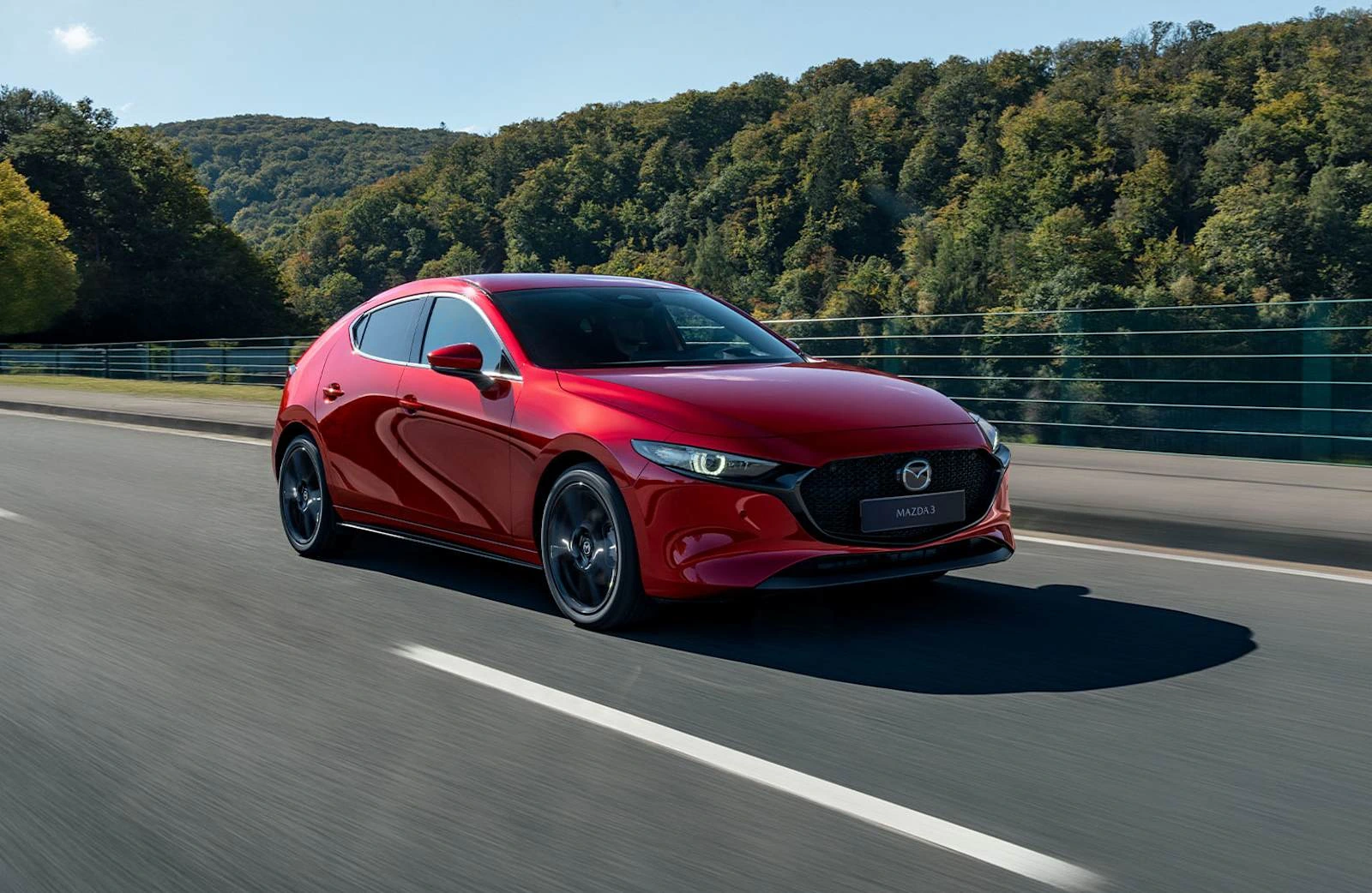 Mazda3 with smooth body surfaces reflecting light