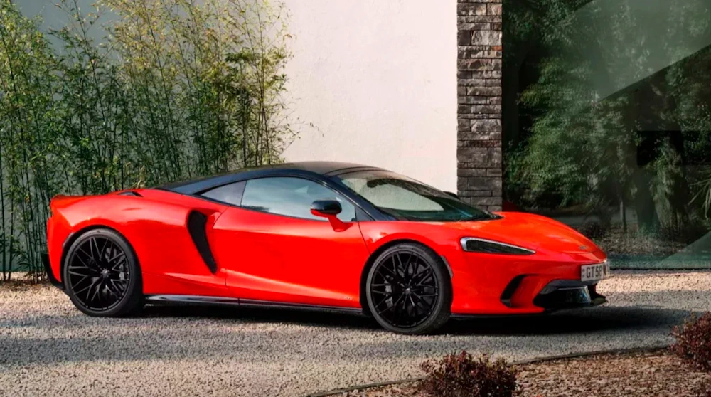 Red McLaren GTS in manufacturer exterior photography