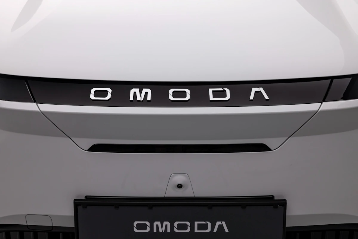 Close-up of the OMODA wordmark on an SUV