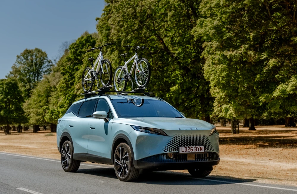 OMODA 7 with bicycles mounted on its roof in OMODA UK campaign photography