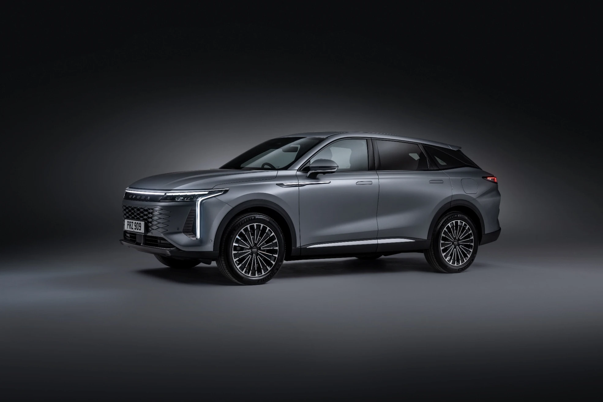 Grey OMODA 9 SUV in a studio setting