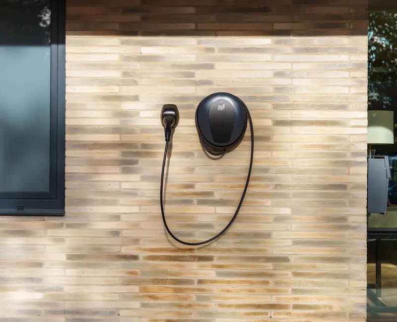 Pod Point tethered home charger mounted on a wall