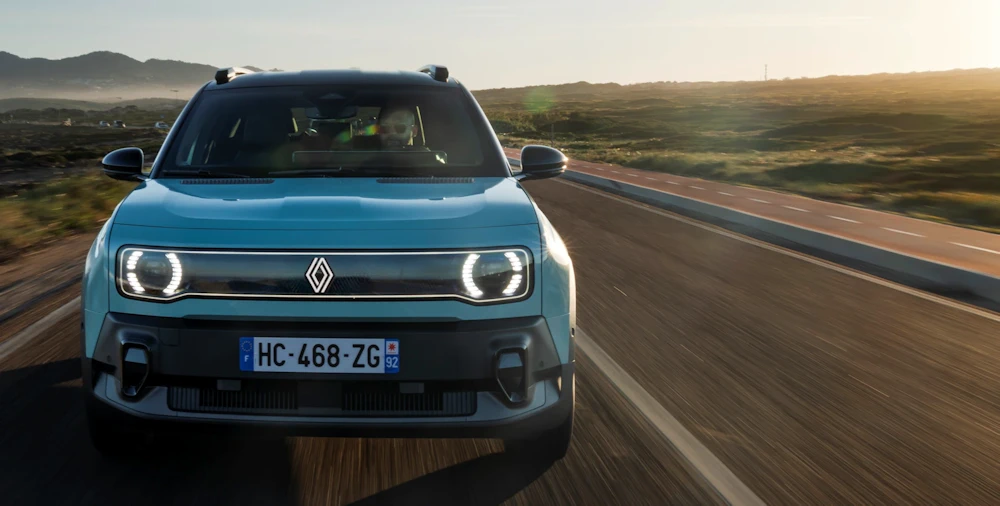 Front view of Renault 4 E-Tech electric on an open road