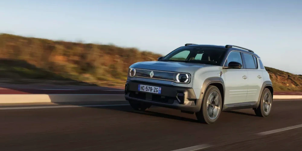 Renault 4 E-Tech electric driving on a country road