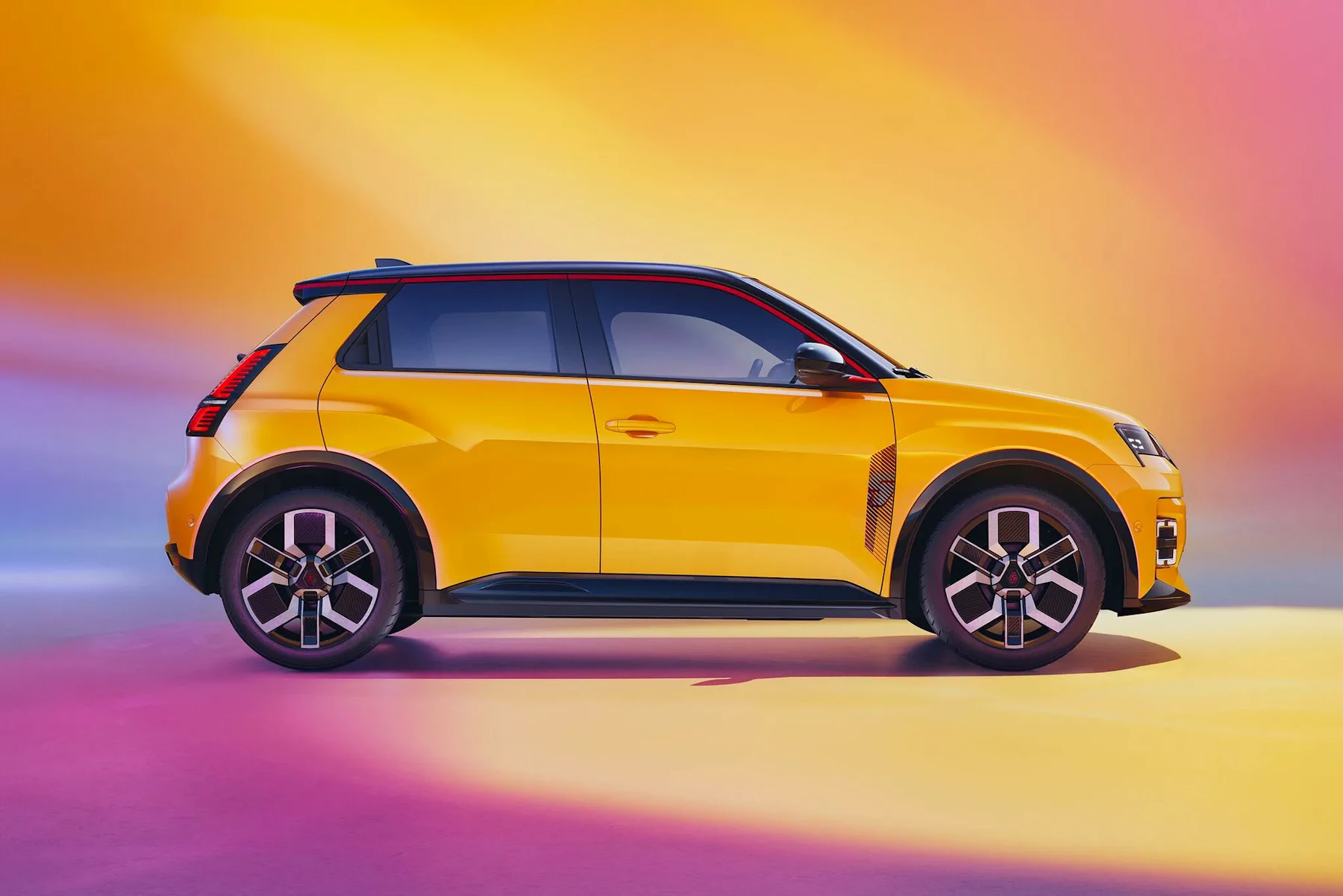Yellow Renault 5 E-Tech electric shown in side profile