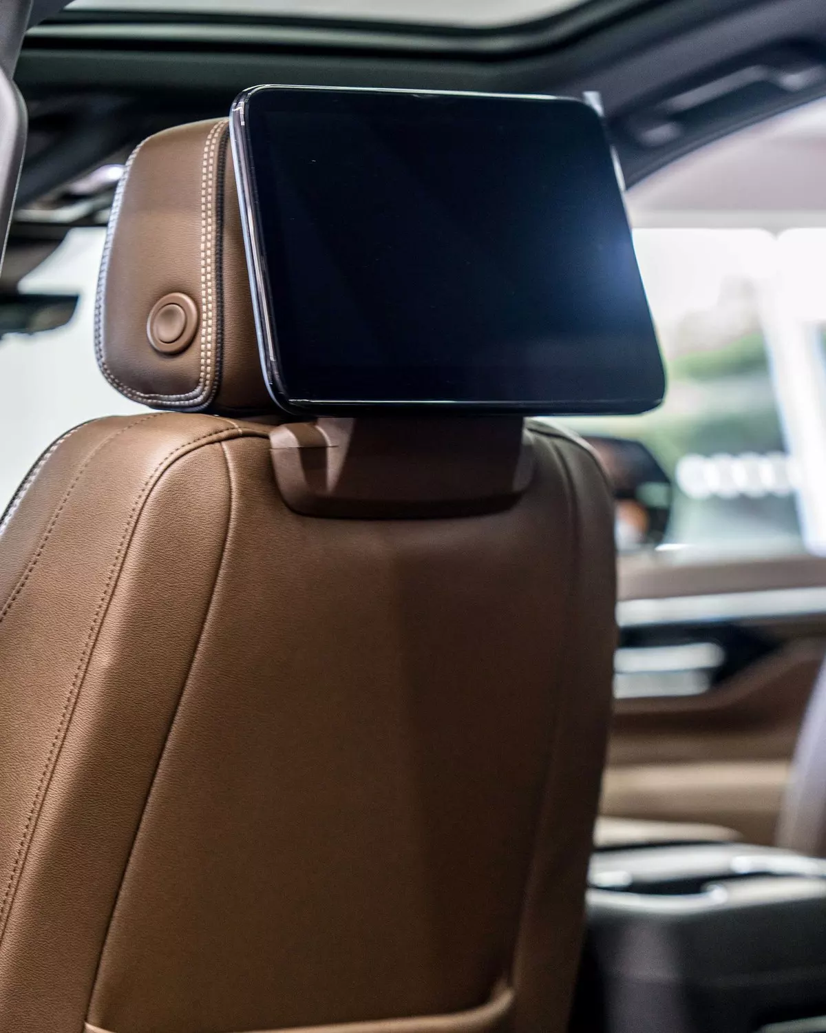 Rear entertainment screen behind a Suburban front seat