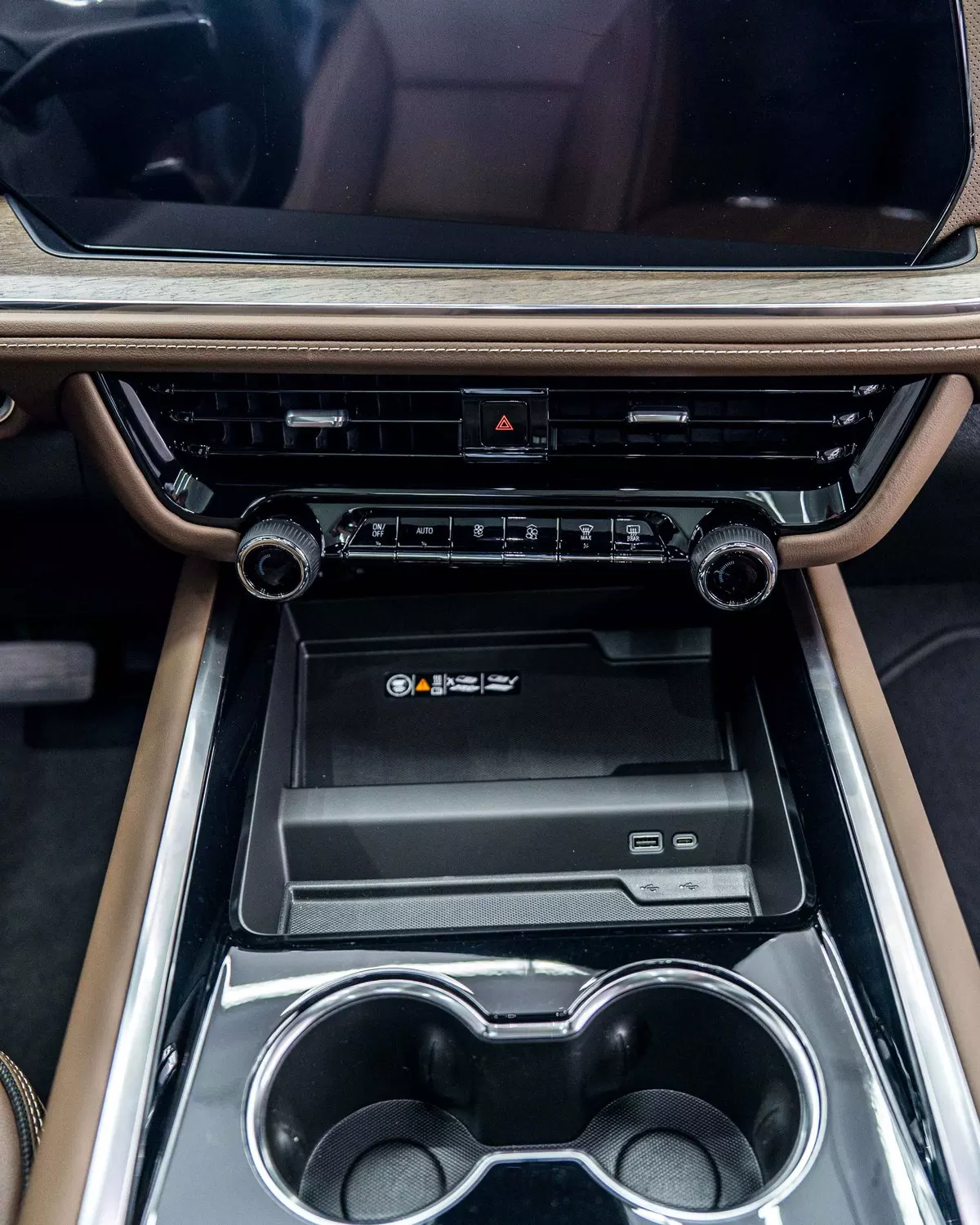 Suburban centre-console storage area and cupholders