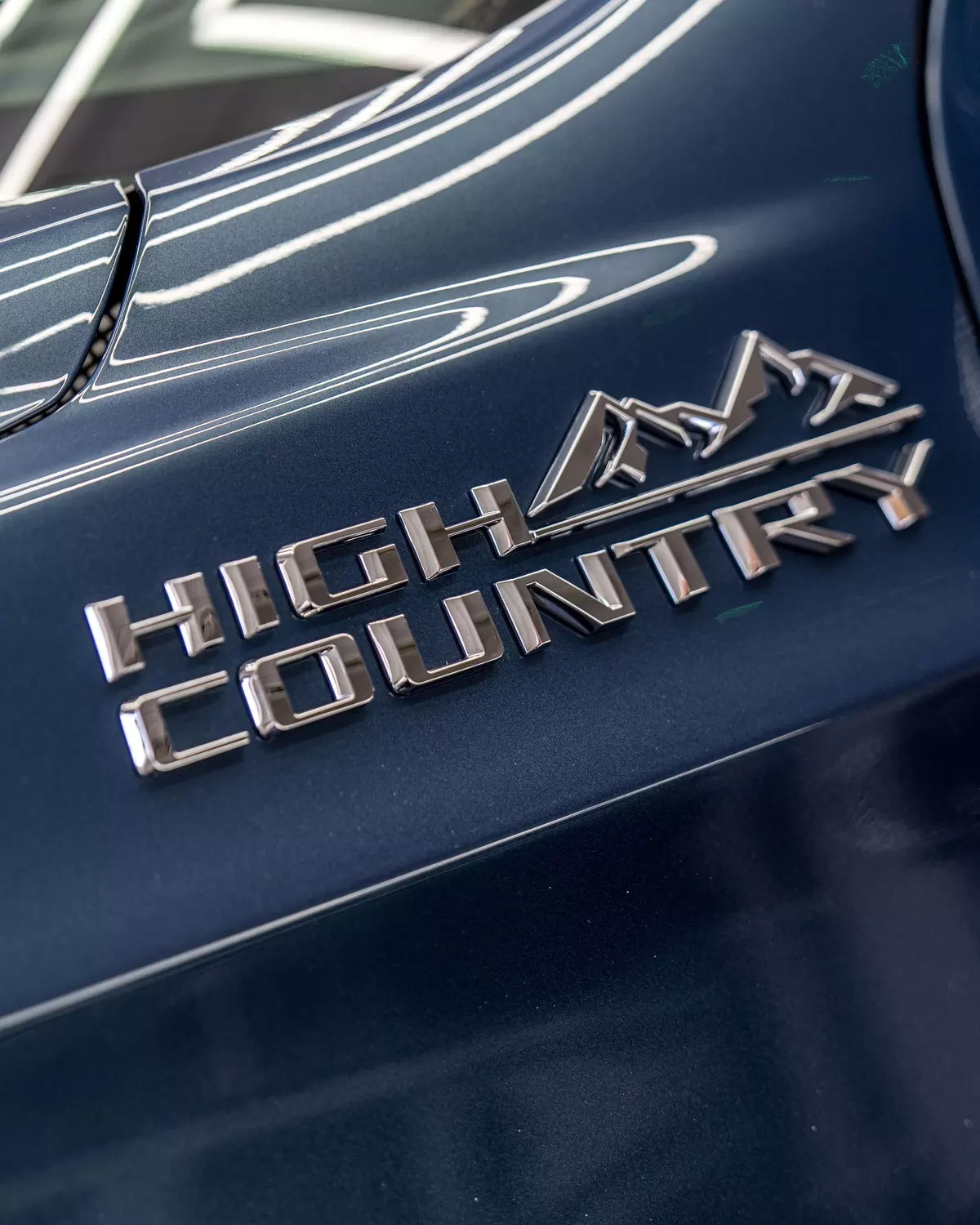 High Country badge on the blue Suburban body