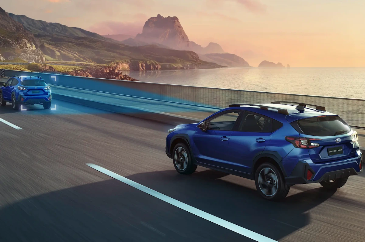 Blue Subaru Crosstrek e-BOXER on a road